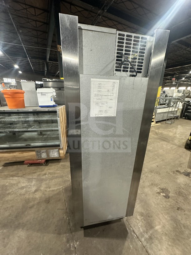 Traulsen stainless steel reach-in fridge/freezer combo, model RHT132WUT-HHS, on casters, includes pan slide and chrome rack.