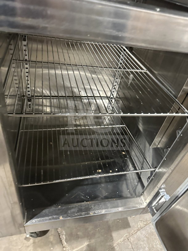 Traulsen RHT132WUT-HHS commercial stainless steel reach-in refrigerator/freezer combo, chrome racks, built-in pan slide.