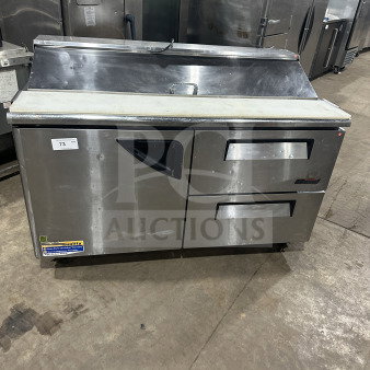 Turbo Air TST60SDD2 stainless steel refrigerated prep table with single solid door, two drawers, and casters.