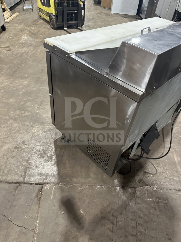 Turbo Air TST60SDD2 stainless steel refrigerated prep table with single door, 2 drawers, bain marie top, on casters.