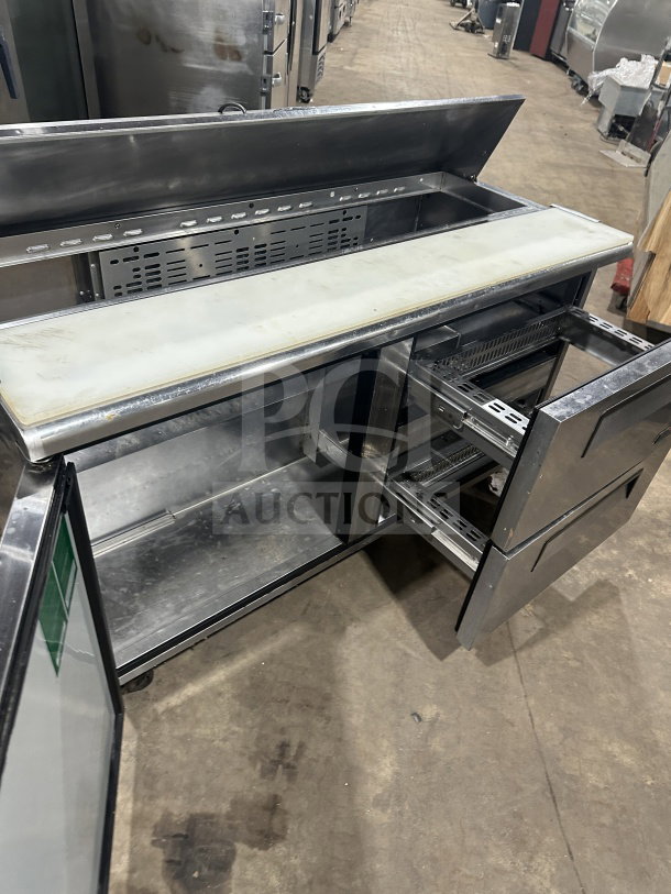 Turbo Air TST60SDD2 stainless steel prep table with single door, two drawers, refrigerated bain marie style, on casters.