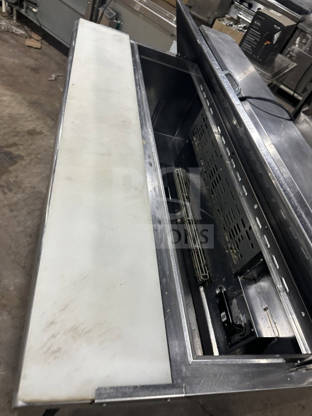 Turbo Air TST60SDD2 refrigerated prep table, stainless steel, single solid door, two drawers, bain marie style, on casters.