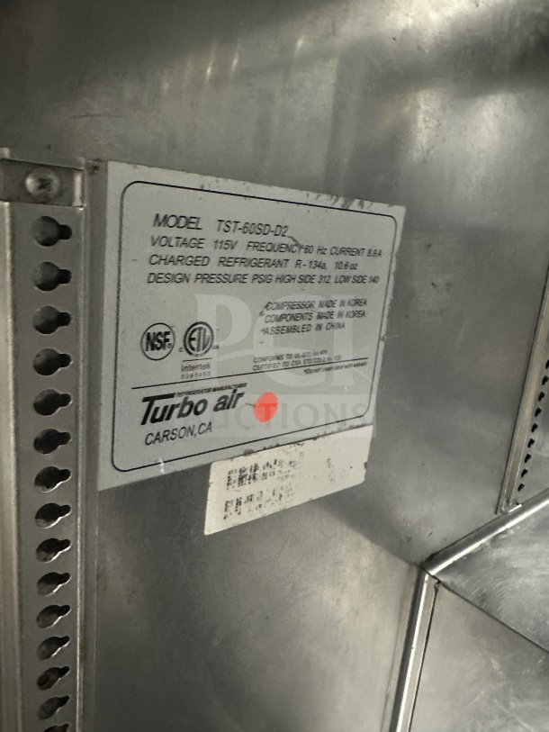 Turbo Air TST60SDD2 stainless steel prep table with single solid door, 2 drawers, 115V, on casters, tag details included.