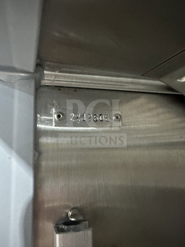 Serial number "2212605" on stainless interior, Beverage Air refrigerator.