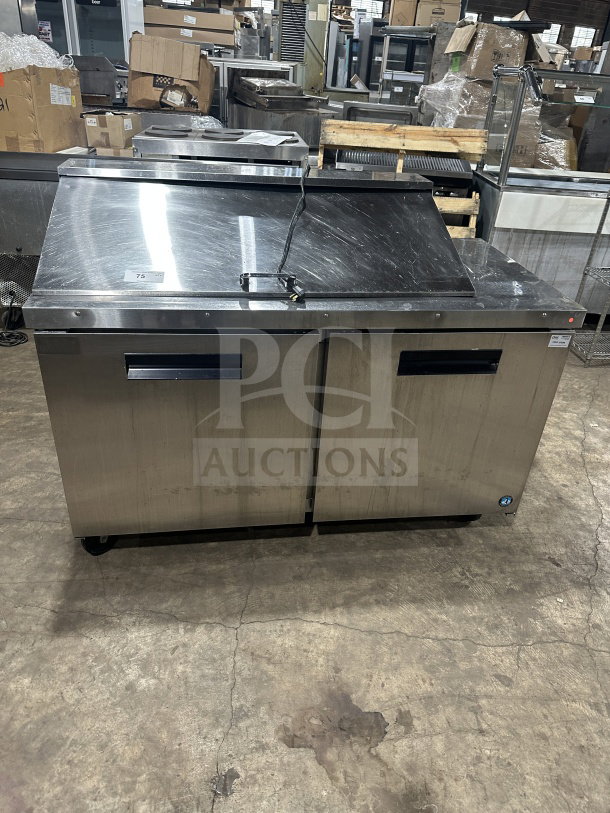 Hoshizaki stainless steel 2-door refrigerated sandwich prep table, model CRMR6018M, on casters, in used condition.