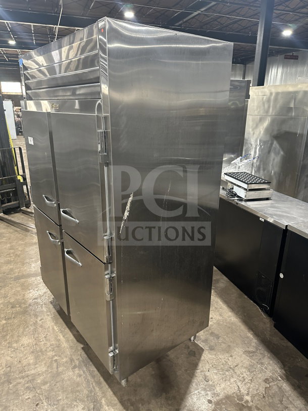 Traulsen SG22300 stainless steel half-door reach-in refrigerator/freezer, poly coated rack, on legs, commercial use.