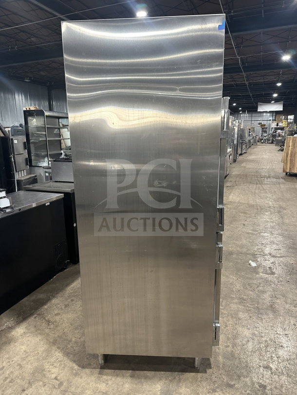 Traulsen SG22300 stainless steel reach-in refrigerator/freezer. Solid half-door, double section, on legs, poly-coated rack.
