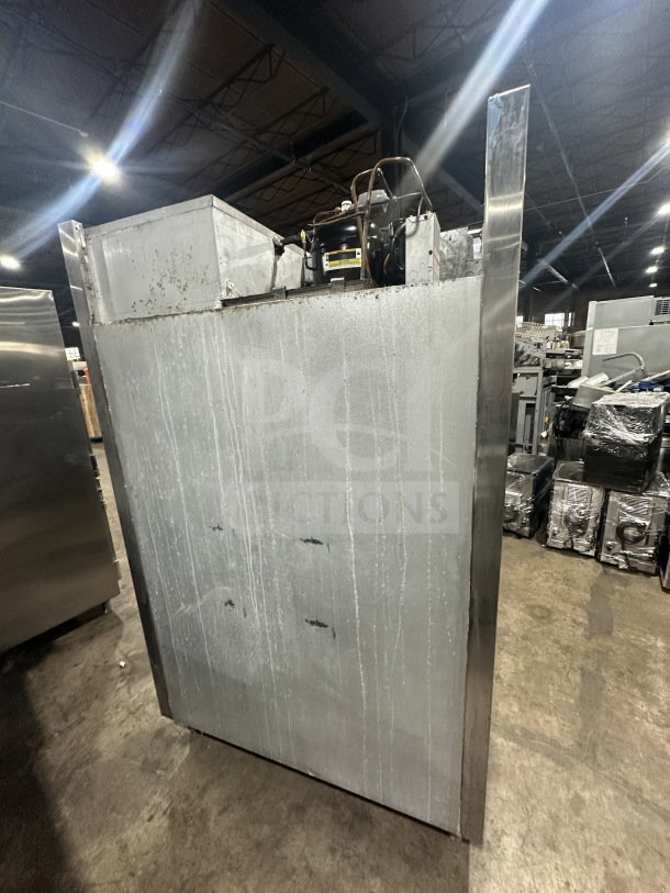 Traulsen SG22300 commercial stainless steel half-door refrigerator/freezer, poly-coated wired rack, on legs, model SN T463590D97.