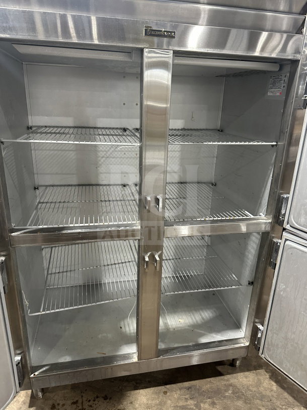 Traulsen SG22300 stainless steel half-door reach-in refrigerator/freezer with poly coated wire racks, on legs, good condition.