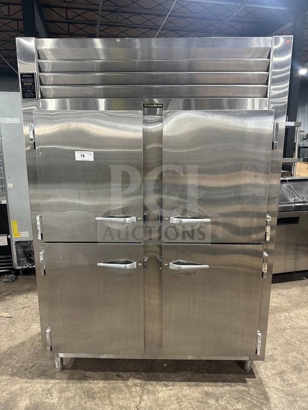 Traulsen stainless steel half-door reach-in refrigerator/freezer, model AHT232WUTHHS, with chrome rack, built-in pan slides.