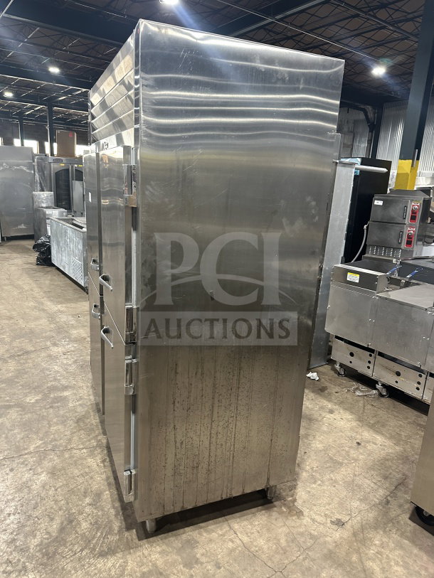 Traulsen stainless steel half-door double section reach-in refrigerator/freezer. Model AHT232WUT-HHS, with rack and pan slides.