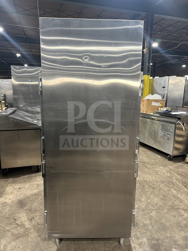 Traulsen AHT232WUTHHS commercial stainless steel half-door refrigerator/freezer, chrome rack, pan slides, on legs.
