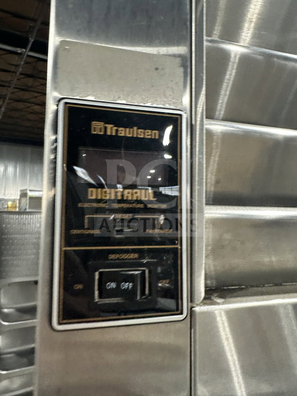 Traulsen stainless steel reach-in refrigerator/freezer, Model AHT232WUT-HHS, with digital temp monitor and built-in pan slides.
