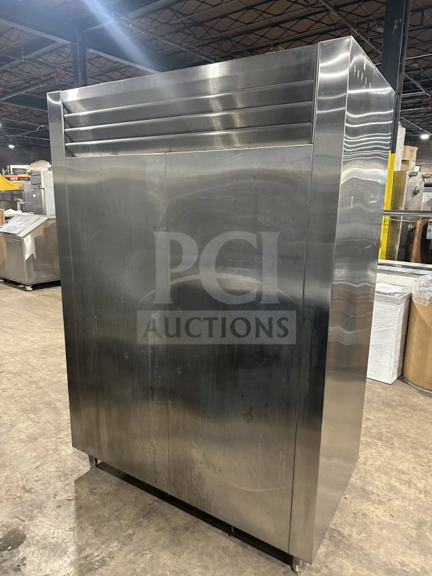 Traulsen stainless steel half-door refrigerator/freezer, model AHT232WUT-HHS, with chrome racks and pan slides. Good condition.
