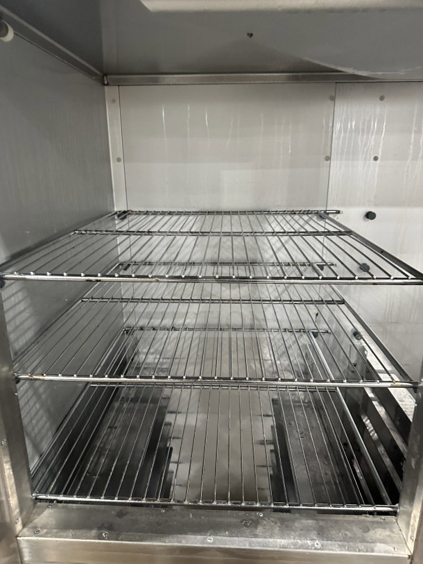 Traulsen AHT232WUTHHS commercial refrigerator/freezer, stainless steel, half-door, double section, chrome rack, pan slides.