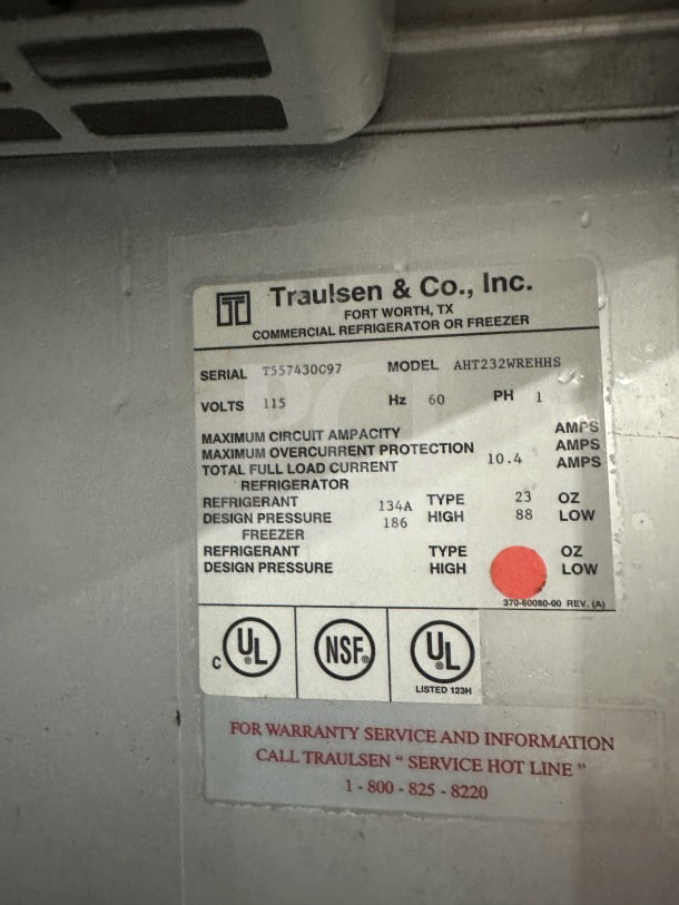 Traulsen commercial refrigerator/freezer model AHT232WUTHHS label showing specifications, serial number T557430C97, and certifications.