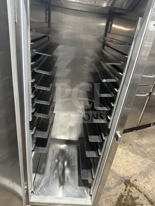 Beverage Air commercial stainless steel single-door reach-in refrigerator with tray slides, shown open, on legs.