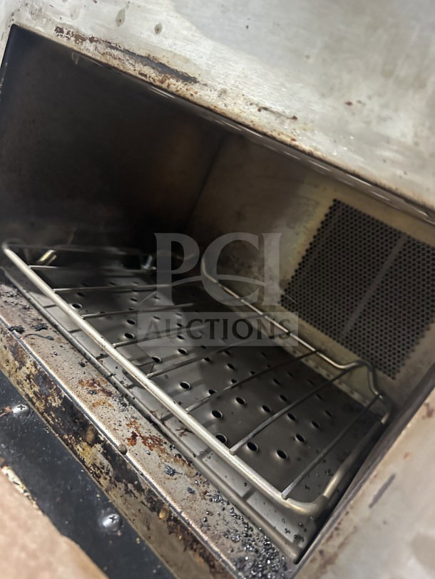 TurboChef NGO commercial rapid cook oven, electric countertop model with digital controls, on legs, visible wear.