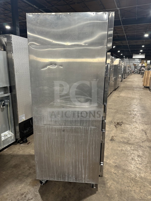 Continental 2-door stainless steel refrigerator, model DL1WEHD, on casters. Energy Star certified. Some visible wear.