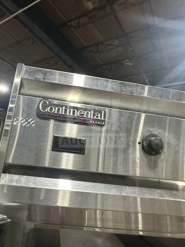 Continental DL1WEHD stainless steel refrigerator, 2-door, Energy Star, on casters, includes rack & shelf, model visible.