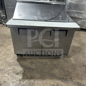 True commercial stainless steel 2-door refrigerated prep table with mega top, Model TSSU-48-18M-B-HC, on casters.