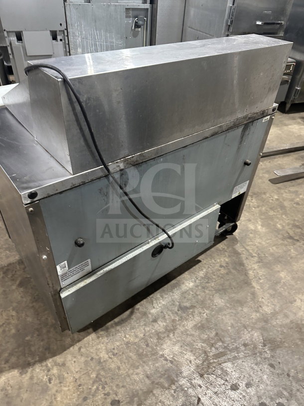 True TSSU-48-18M-B-HC 2-door refrigerated prep table, stainless steel, on casters, with poly-coated wired rack.