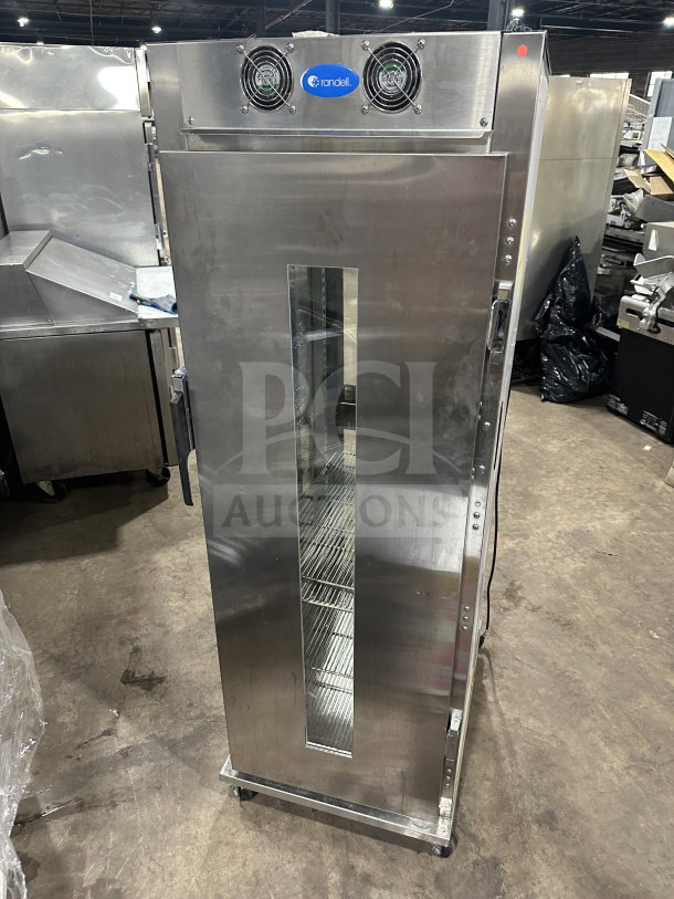Randell PHHC26 commercial glass half-door fridge, chrome racks, 115V, 1 phase, on casters, good condition.
