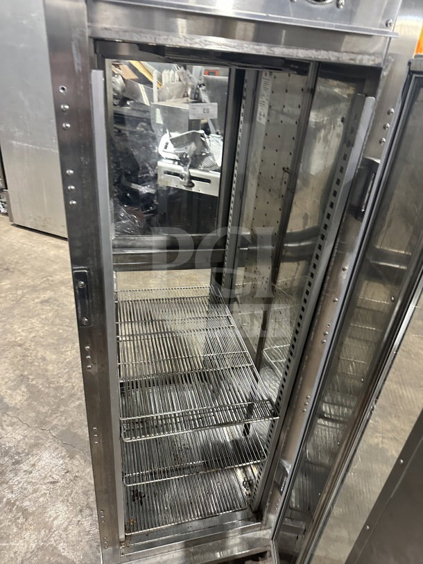 Randell PHHC26 glass half-door display refrigerator, electric, chrome-plated rack, used, on casters, model SN W19332611.