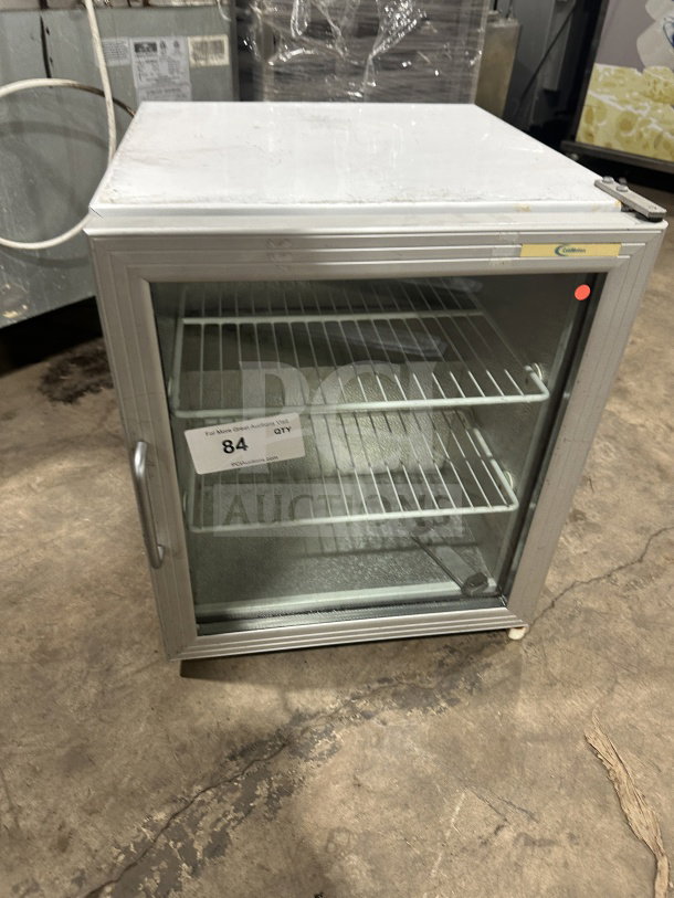 Commercial countertop single glass-door display cooler with poly-coated wire rack and legs, used condition.