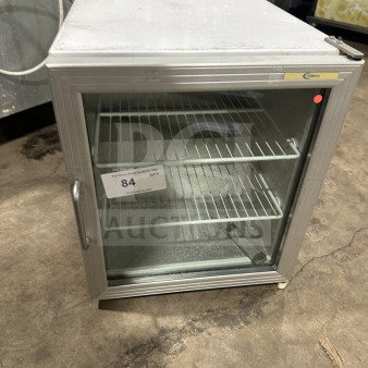 Commercial countertop single glass-door display cooler with poly-coated wire rack and legs, used condition.