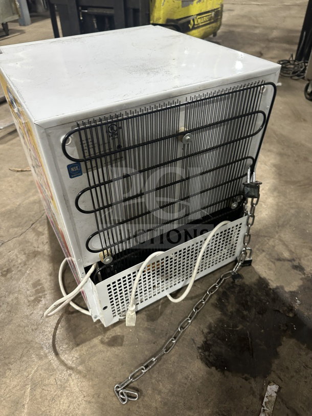 Commercial countertop single glass-door display cooler/freezer with poly-coated wired rack, on legs, good condition.
