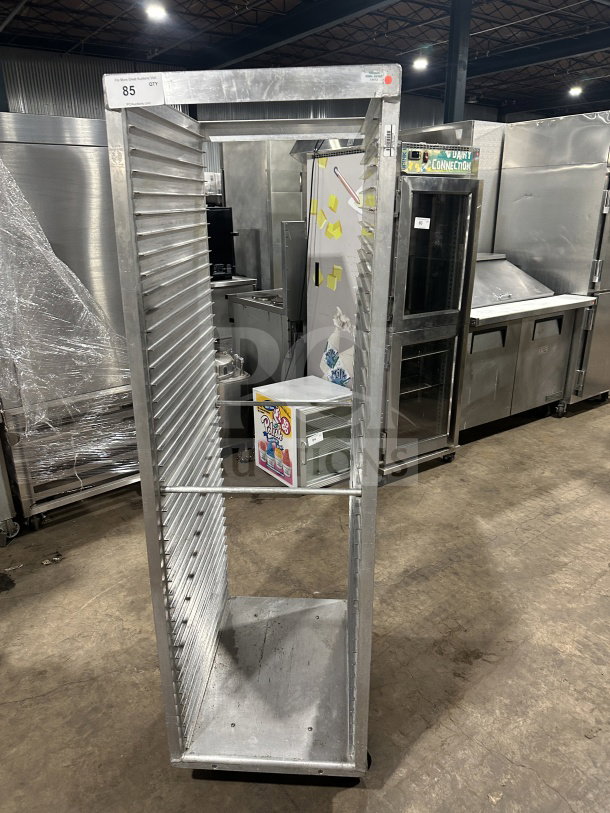 Commercial stainless steel sheet pan rack on casters, heavy-duty construction, excellent condition, item number 85 visible.
