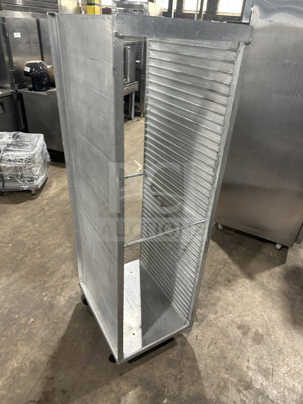 Commercial stainless steel sheet pan rack on casters, heavy-duty design, excellent condition, ideal for catering use.