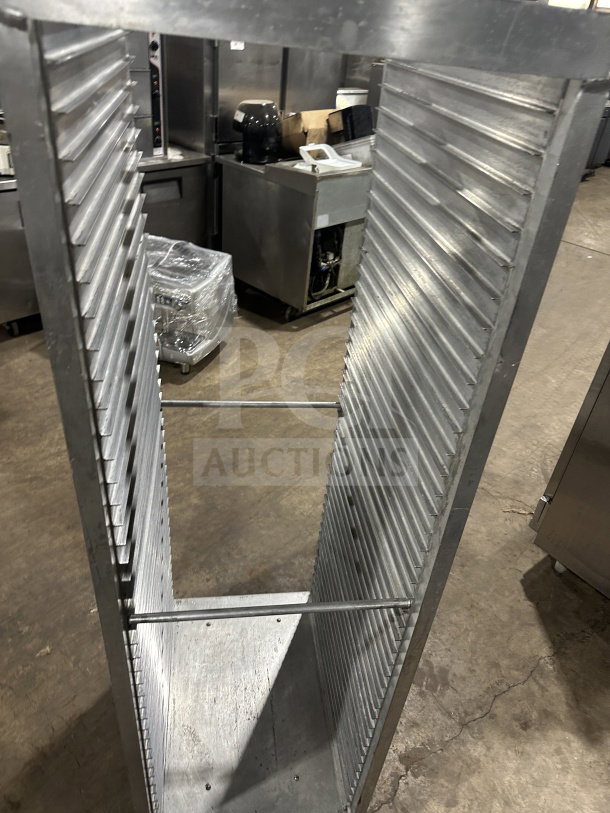 Commercial stainless steel heavy-duty sheet pan rack on casters, excellent condition, vertical view.