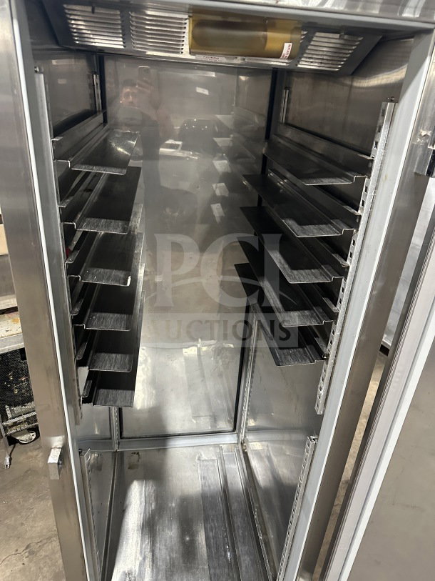Beverage Air stainless steel single-door commercial refrigerator. Electric-powered, multiple shelves, solid construction, on legs.