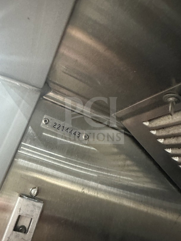 Beverage Air stainless steel commercial refrigerator, single-door, electric-powered, serial number 2214443, on legs.