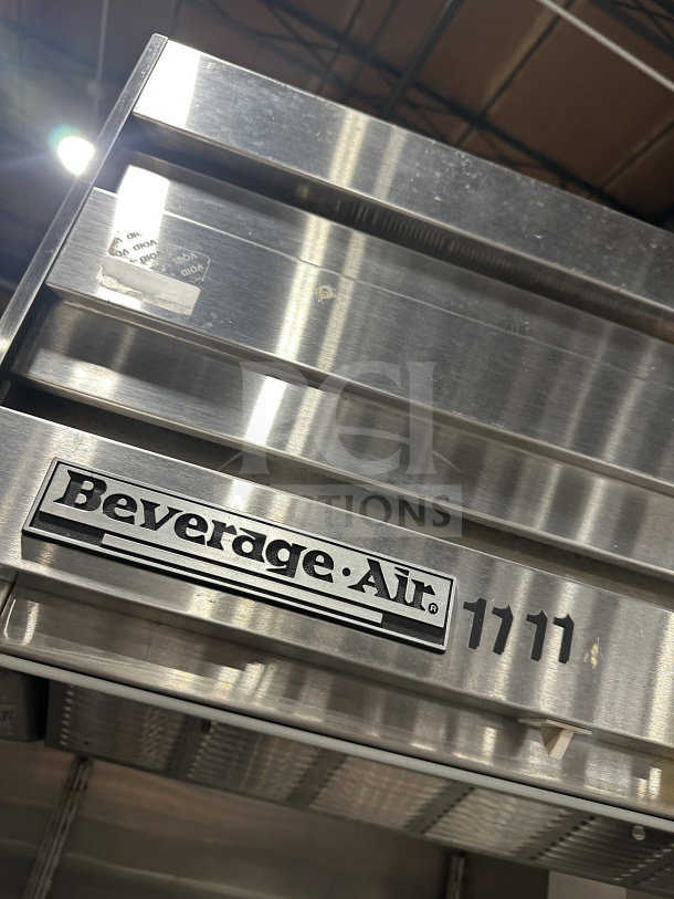 Beverage Air stainless steel 2-door reach-in refrigerator with poly-coated wire racks. Branded label "1111" visible.