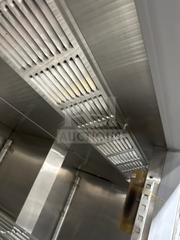 Beverage Air commercial stainless steel 2-door reach-in refrigerator interior, showing poly-coated wire racks and ventilation.