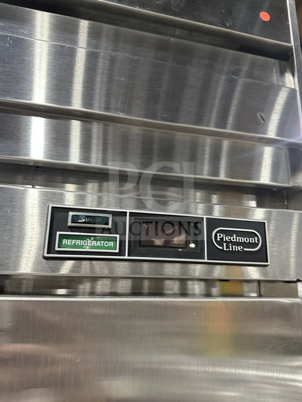 Beverage Air stainless steel 2-door refrigerator, includes Polly coated wire racks, Piedmont Line label visible, on legs.
