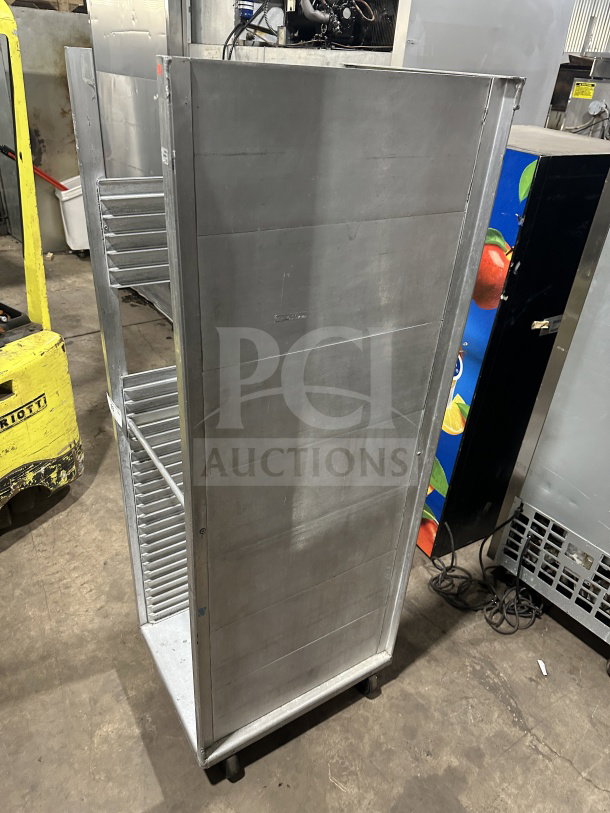 Commercial stainless steel heavy-duty welded pan rack on casters, excellent condition, multiple shelf slots.