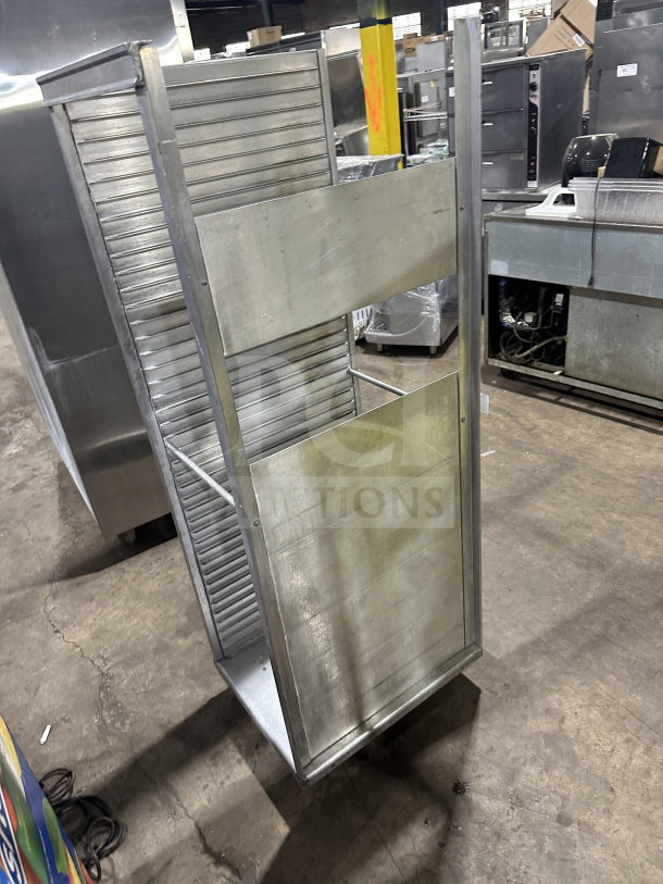 Commercial stainless steel heavy-duty welded pan rack on casters, excellent condition, ideal for bakeries.