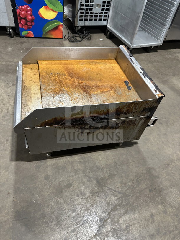 Southbend commercial stainless steel natural gas flat griddle with back and side splash; worn condition, on legs.