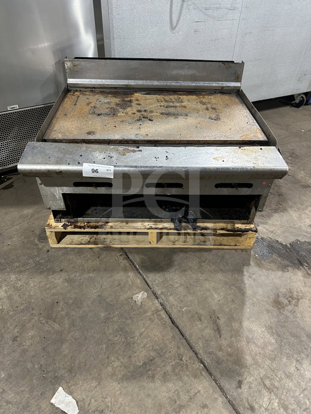 American Range stainless steel natural gas countertop flat griddle with back and side splash, used condition, item tag 96.