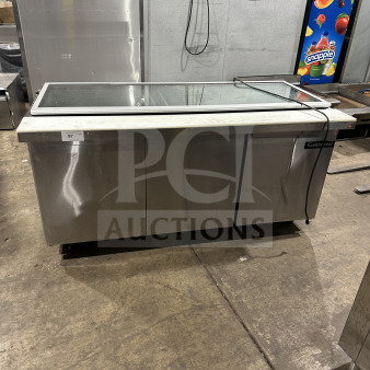 Continental 3-Door Stainless Steel Refrigerated Prep Table, Model SW72-30M, with glass lid and casters, in used condition.