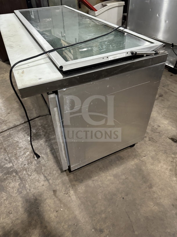 Continental SW72-30M 3-door stainless steel prep table with glass lid, on casters. Serial: 15580567, 115V, 1 phase.