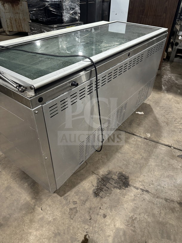 Continental SW72-30M stainless steel 3-door prep table with glass lid, on casters, used condition, 115V 1 phase. SN: 15580567.