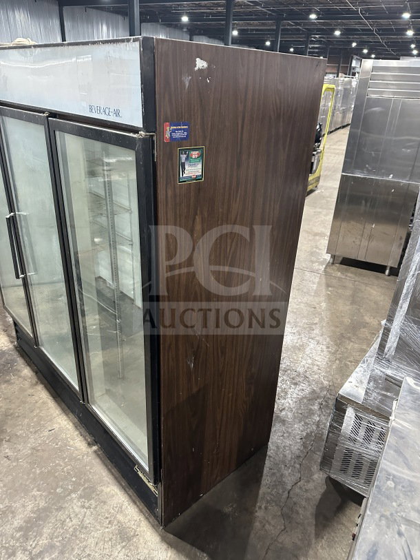 Beverage Air MT72 commercial 3 glass door reach-in merchandiser refrigerator/freezer with poly coated wire rack. Model SN: 2615804.