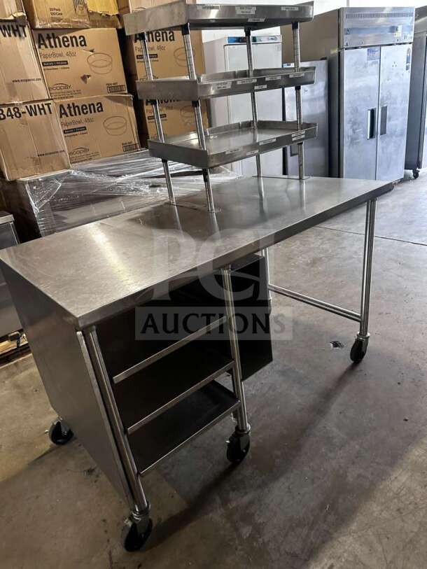 Stainless steel commercial work table, approx. 60"x36", with multi-tier overshelf and wheels. Inspected, ready for use.