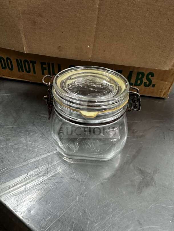 Bormioli Rocco Fido 1/2L glass jar, pristine condition, airtight clamp lid, "Made in Italy" marked, with cardboard box.