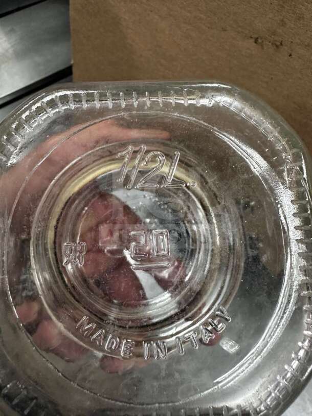 Bormioli Rocco Fido 0.5L glass jar with embossed "1/2L" and "Made in Italy" text, pristine condition, airtight clamp lid.